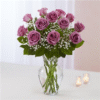 A Dozen Long Stemmed Rose Arrangement In A Glass Urn/Vase With Greenery